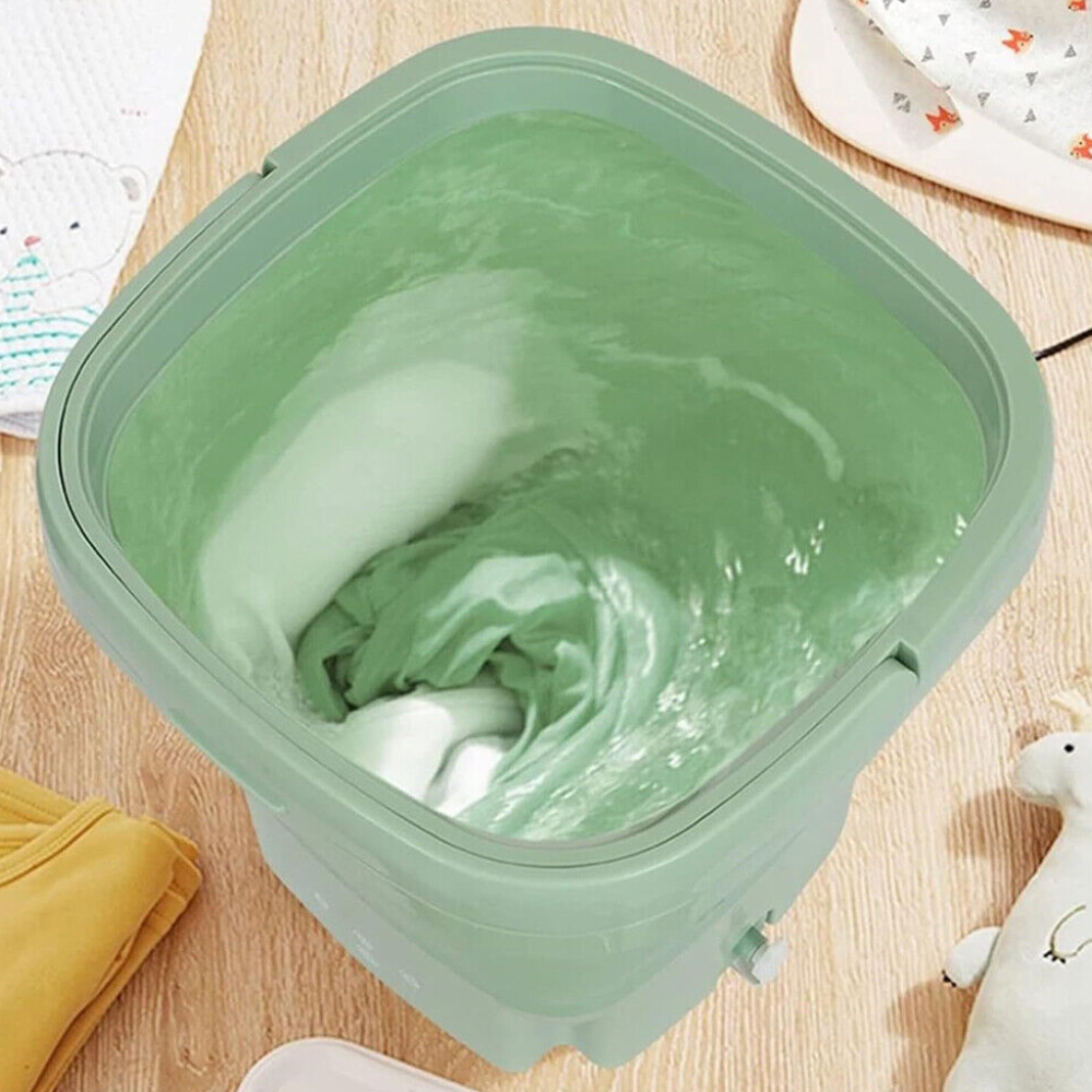 Top-down view of the washing machine in use with swirling water inside.