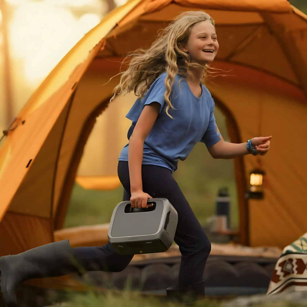 Child holding a cooler near a tent in a camping setting