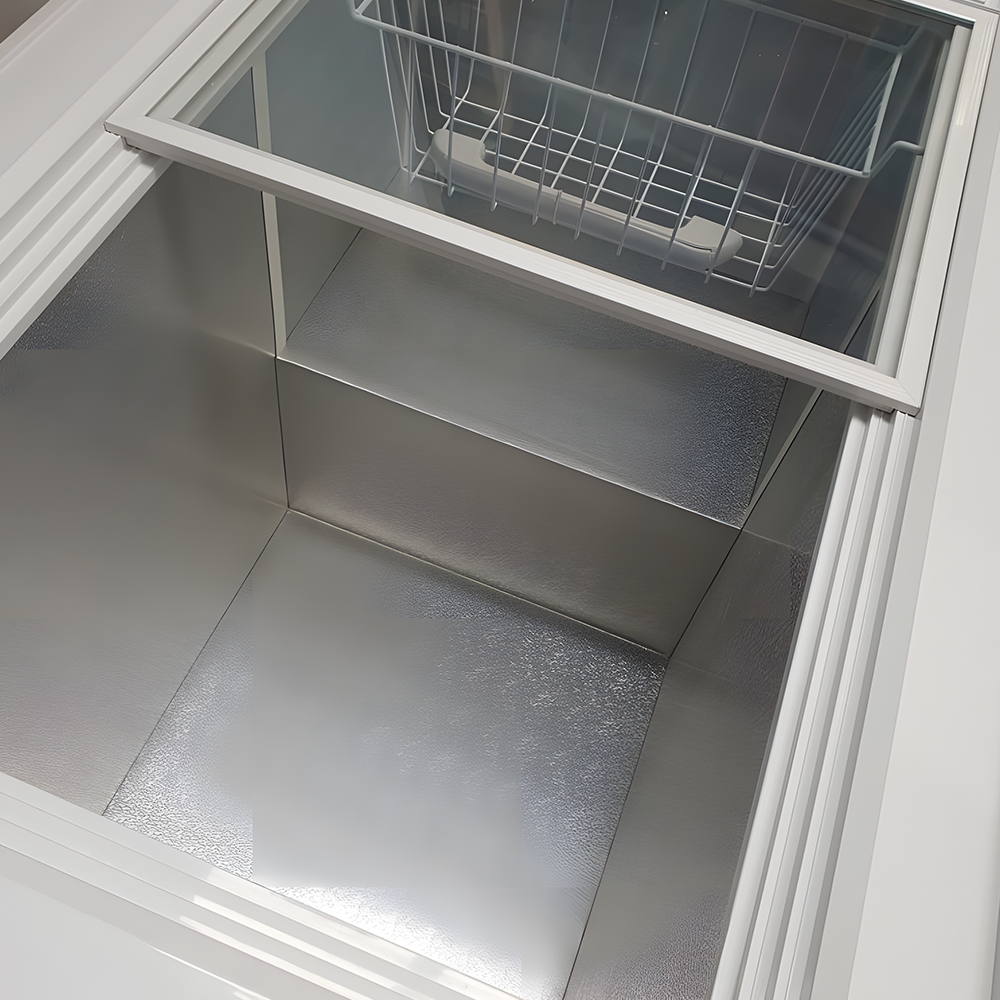 Chest Freezer Internal View – A top-down view of the freezer interior, showcasing its wire basket and smooth metallic storage compartment for optimal cooling.