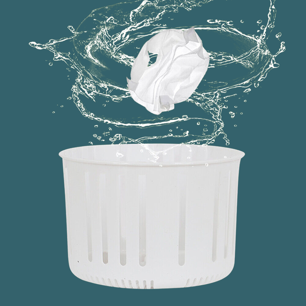 Water splash over a white spin basket, showing the removable basket component in action.