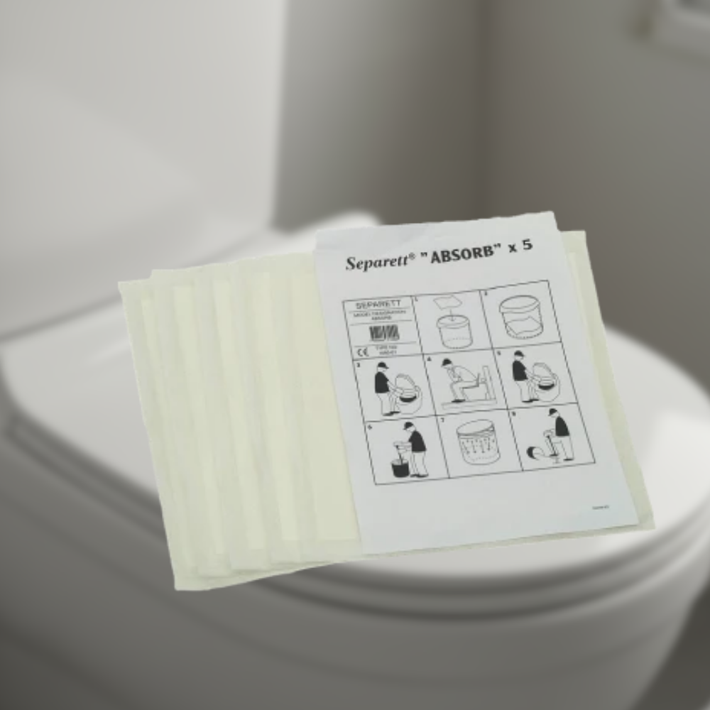 Pack of Separett 'Absorb' pads on a toilet seat