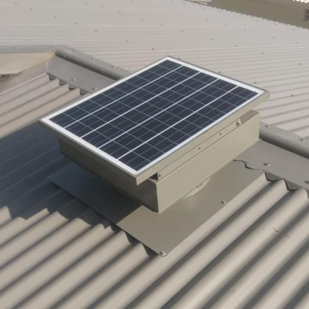 Beige solar ventilator installed on a light grey corrugated roof.