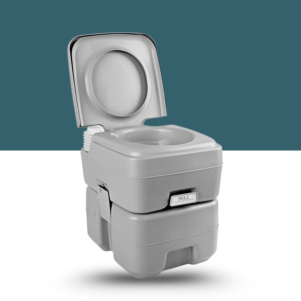 Portable grey camping toilet with open lid and integrated flush system, shown on a teal background.