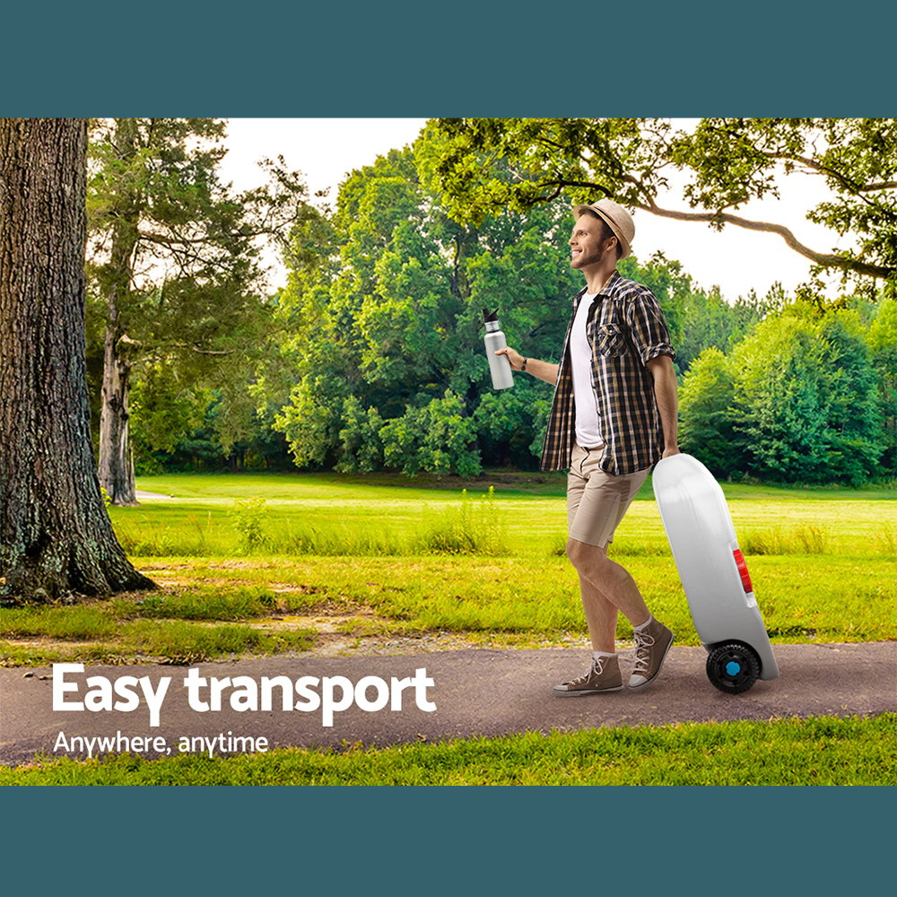 Man pulling the portable water tank outdoors, showing easy transport.