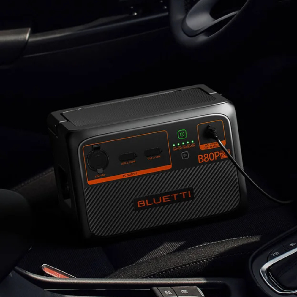 Bluetti power station resting inside a car’s central console, showing in-car usage.