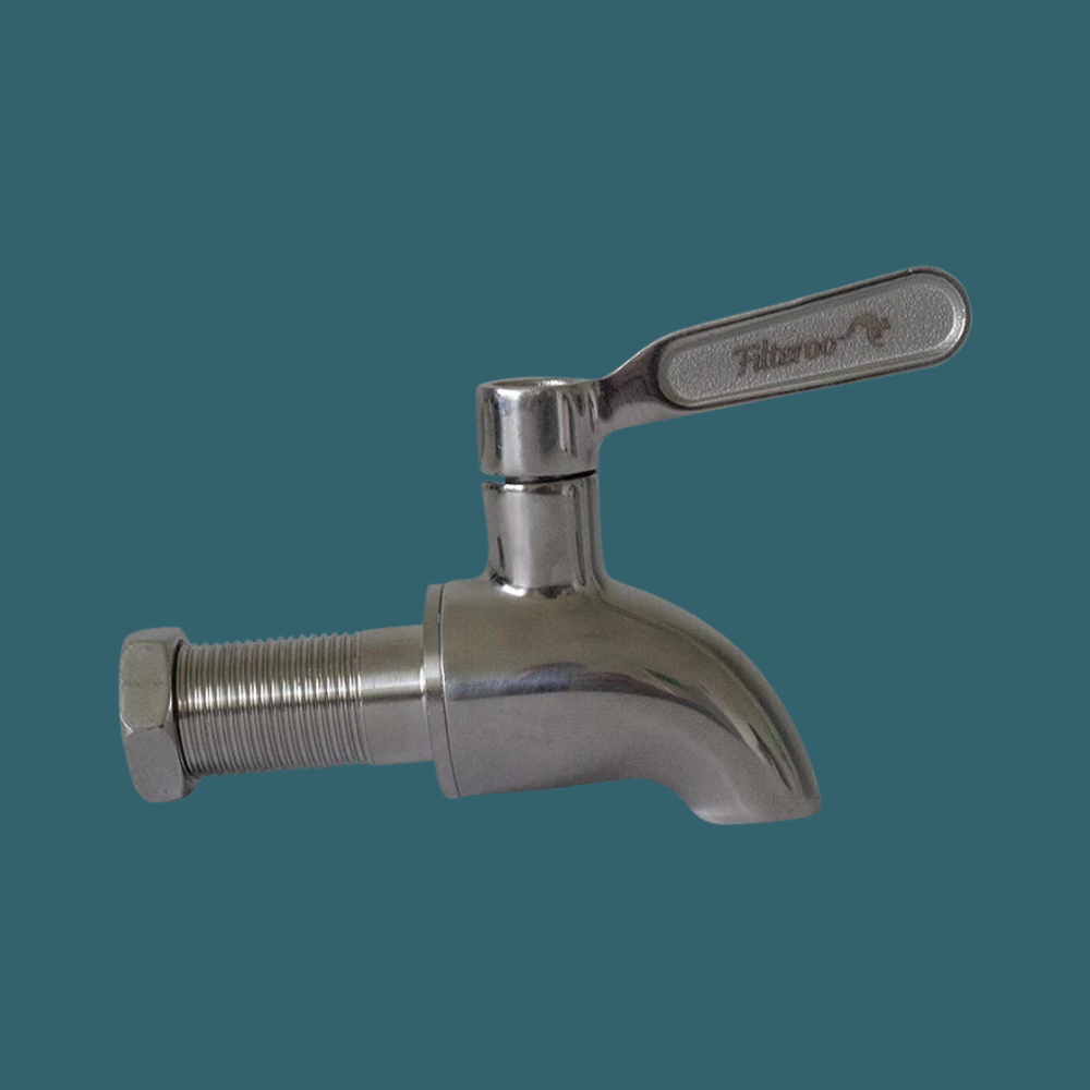 Metal faucet with a handle on a dark green background