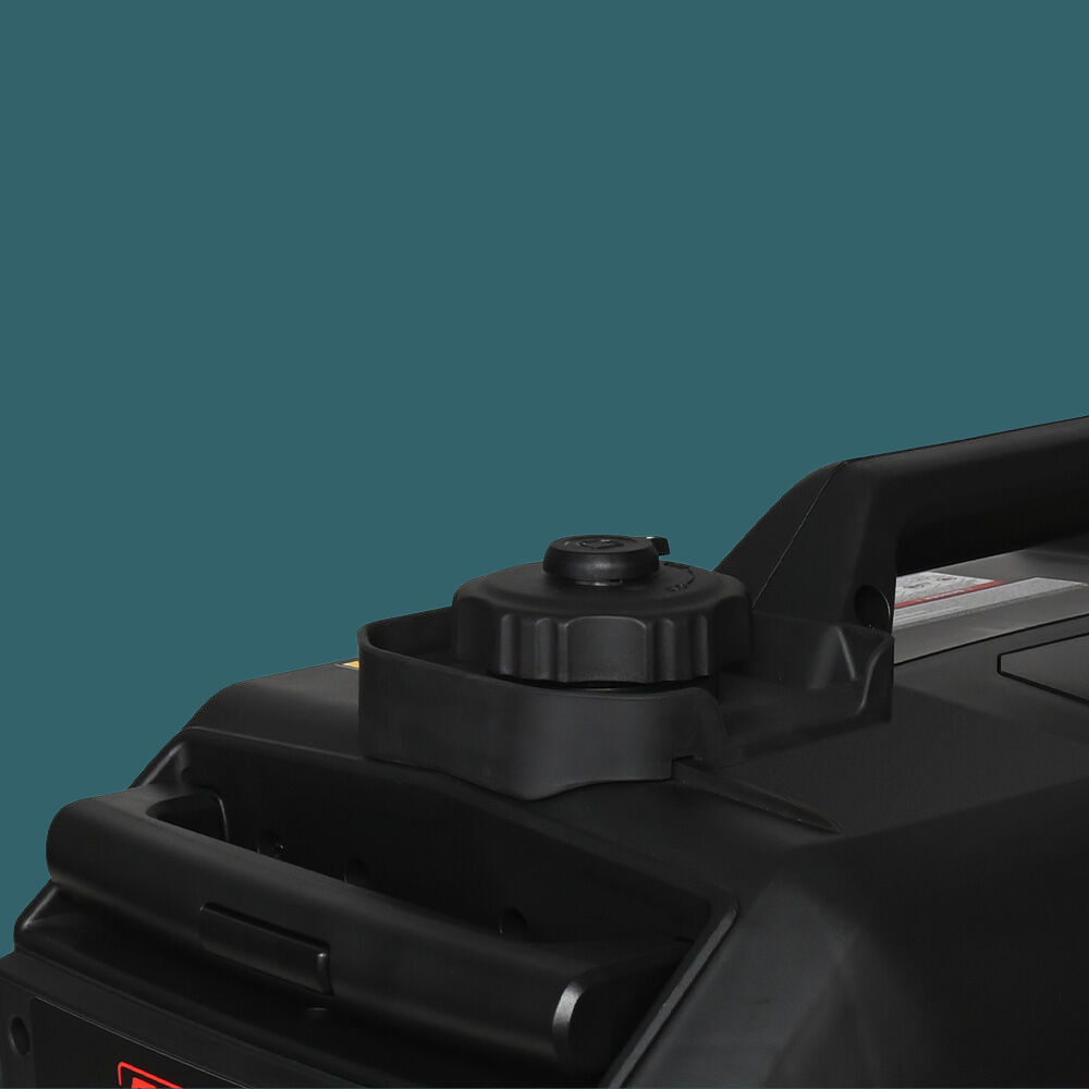 Close-up of a black machine component on a teal background