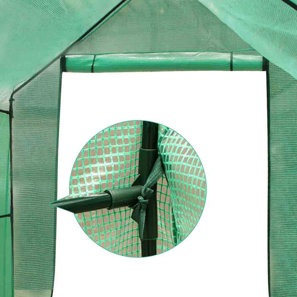 Green mesh screen with a circular inset showing a black metal bracket.