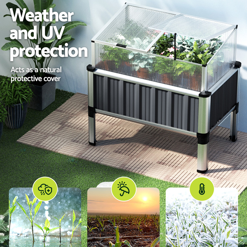 Raised garden bed with weather and UV protection, featuring an openable lid, placed in a lush green environment.