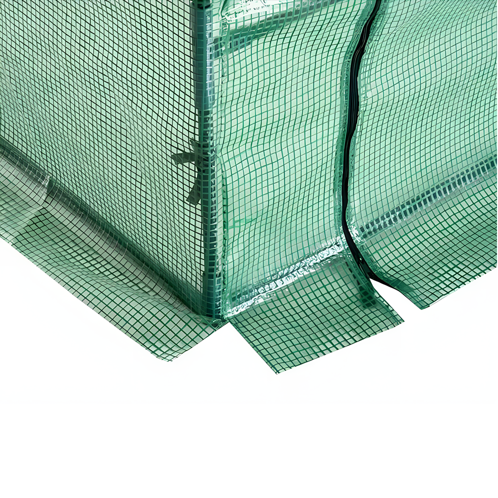 A close-up view of the bottom corner of a green greenhouse cover, showcasing the transparent mesh material and a visible seam with a tie strap