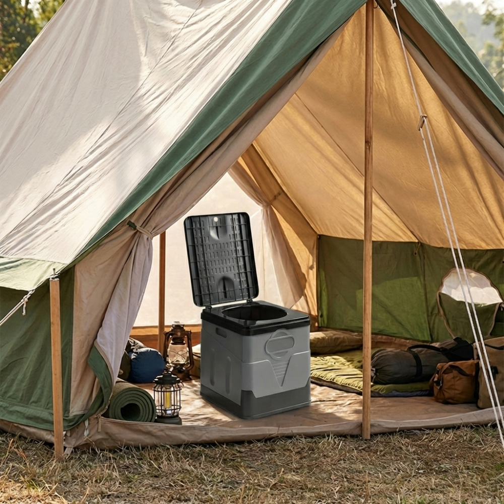 The toilet is positioned inside a beige canvas bell tent. It sits on the tent floor near sleeping gear and a lantern, illustrating a "glamping" or camping setup.