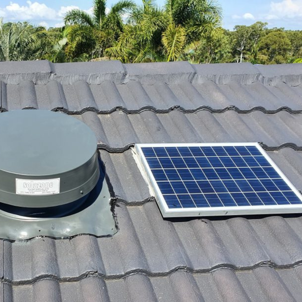 Solar roof ventilator installed on grey tiled roof.