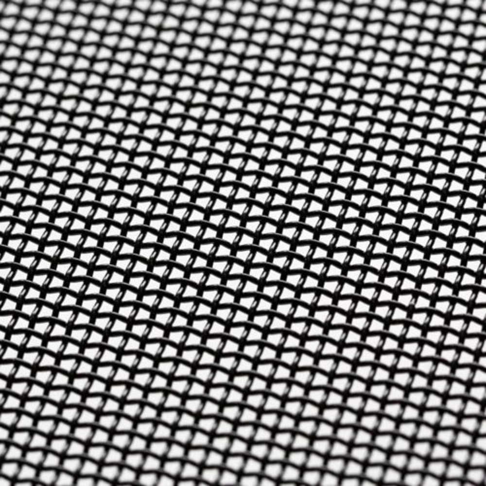 An extreme close-up view of the black metal mesh reveals a tight, durable weave pattern designed to block embers.