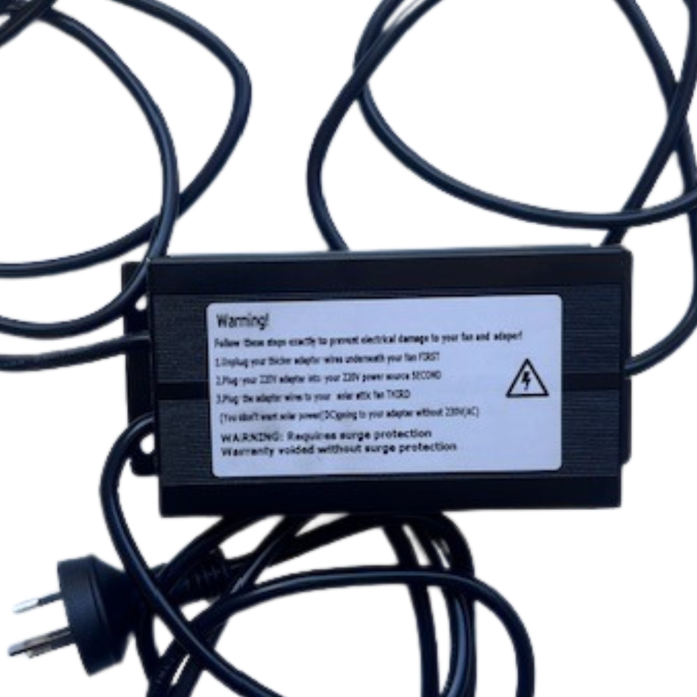 A black power adapter unit is shown with cables, featuring a warning label about connection order and surge protection requirements.