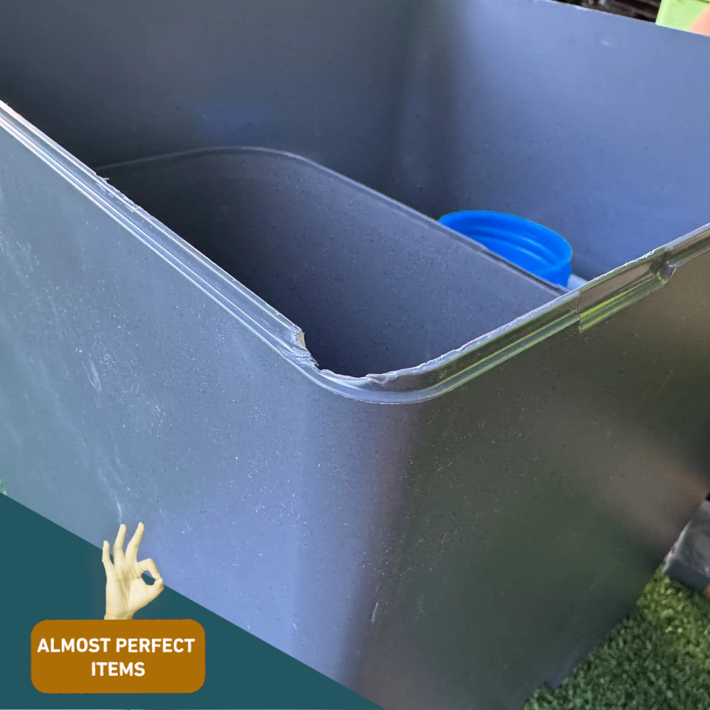 Damaged inner edge (scratched interior corner):
Interior corner of the composting toilet with visible scratches and wear, near the urine diverter area. Labelled as "Almost Perfect".