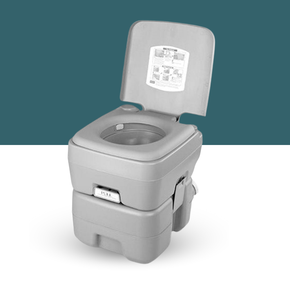 Open grey portable toilet with instruction label visible on the upright lid, displayed on a teal and white background.