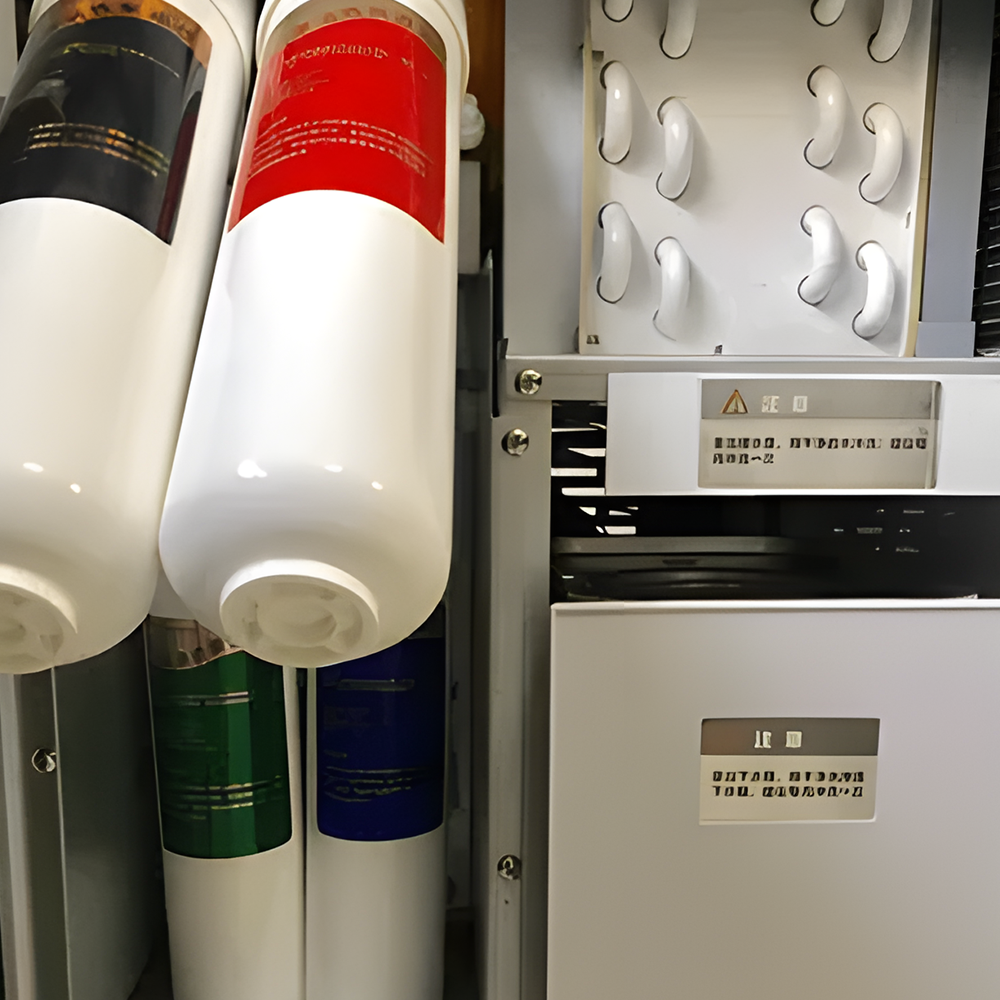 Close-up view of the filtration system inside a WES atmospheric water generator, displaying multiple cylindrical filters in different colours, showcasing advanced purification technology.