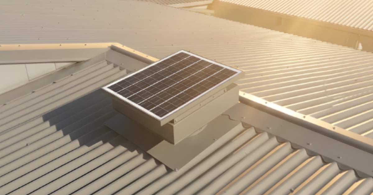 A solar-powered roof ventilator installed on a corrugated metal roof, capturing bright sunlight for off-grid cooling.