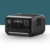 Portable power station with display and multiple ports on a teal background – A compact black power station unit with LED screen and input/output ports shown at an angle.

