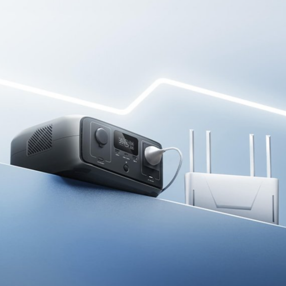 Power station charging via wall socket with glowing line illustration – A sleek black power station plugged into a wall, with an animated power line graphic suggesting fast or smart charging.