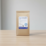 Brown paper package with a label on a wooden surface and light gray background