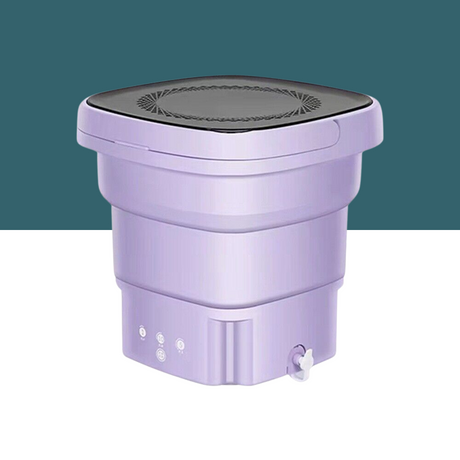 Collapsible purple mini washing machine with a black lid, drain valve, and control buttons, placed on a white and teal background.
