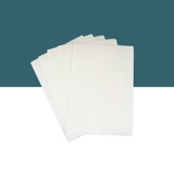 Separett Tiny® absorb pads shown in a fanned-out stack against a teal and white split background.
