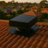 Solar roof ventilator installed on a tiled roof overlooking an Australian suburban neighbourhood at sunset.