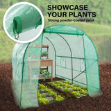 A greenhouse in use, showcasing plants inside while highlighting its structure and ability to support plant growth in a controlled environment.