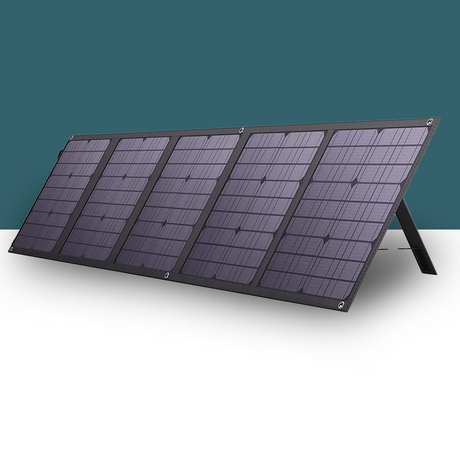 A fully unfolded solar panel with multiple panels connected in a sleek design, standing on kickstands, displayed against a teal background.