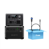 Bluetti portable power station bundle including the main unit and an additional battery pack stacked together. A free charging cable is shown in a blue gift box to highlight included accessories