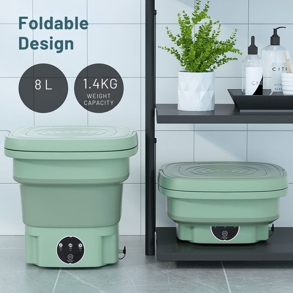 Two green foldable containers with weight capacity and volume information on a tiled floor.
