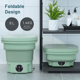 Two green foldable containers with weight capacity and volume information on a tiled floor.