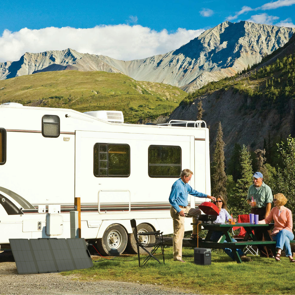 Family at a campsite with an RV in a mountainous area