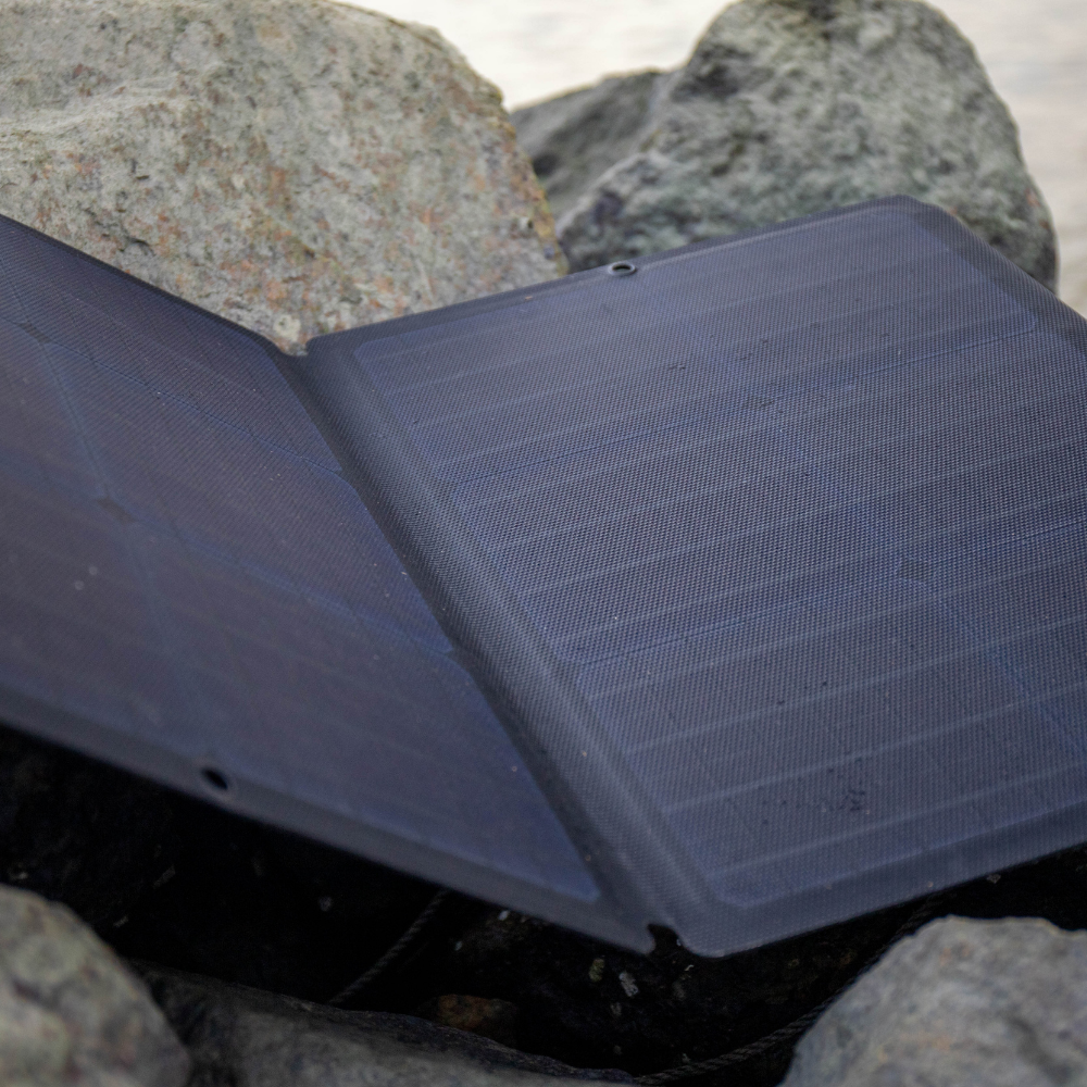 Foldable solar panel on a rocky surface