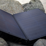 Foldable solar panel on a rocky surface