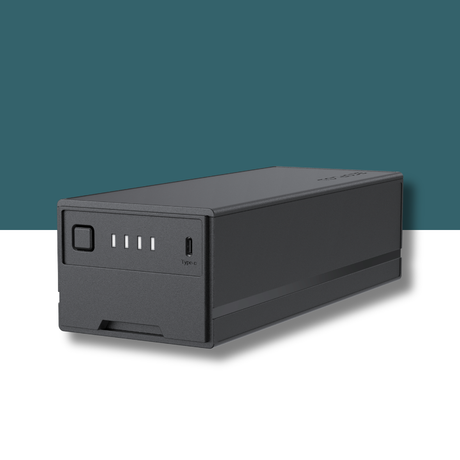 Compact 298Wh Glacier Plug‑in Battery on teal and white background