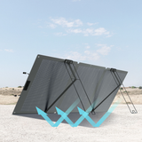 Foldable solar panel on a sandy ground with a clear sky