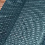 Close-up of a textured blue surface with grid pattern