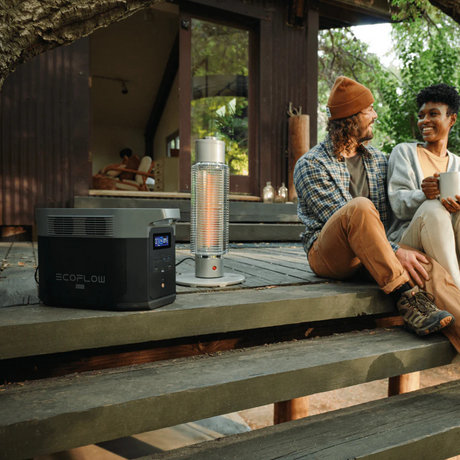 Two people sitting on a wooden deck with an EcoFlow device and patio heater.