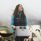 Woman holding an EcoFlow product in a natural setting