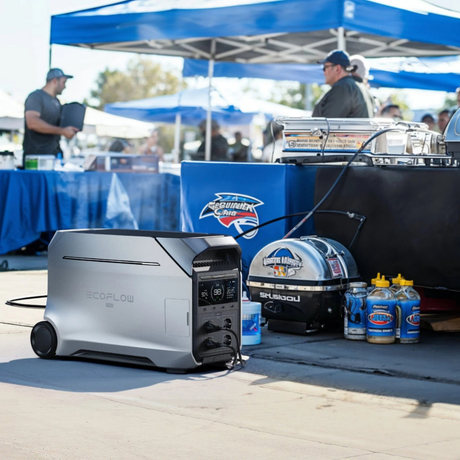 ECOFLOW power station with a grill and燃料容器 at an outdoor event.