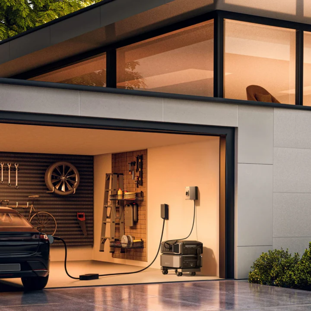 Modern house with a garage featuring a car charging station and tools.