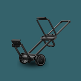Black trolley on a teal background