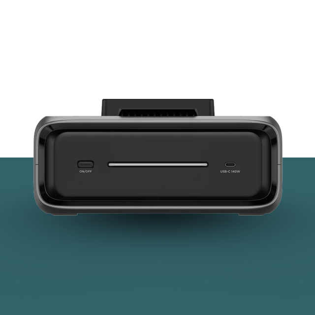 Black electronic device with ports on a gradient background