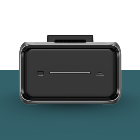 Black electronic device with ports on a gradient background