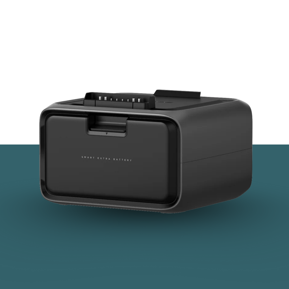 Black battery pack on a two-tone background with green at the bottom and white at the top