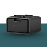 Black battery pack on a two-tone background with green at the bottom and white at the top