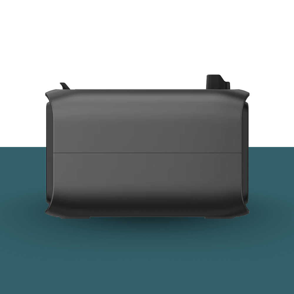 Black rectangular object on a two-tone background with a gradient from white to blue.