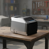 EcoFlow Wave 2 Portable Air Conditioner on a wooden table with a workshop background